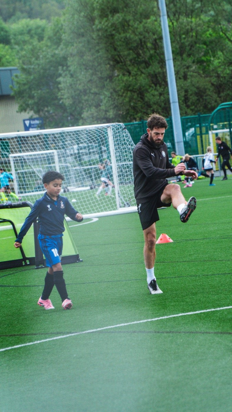 Craig Bentham coaching a player one to one